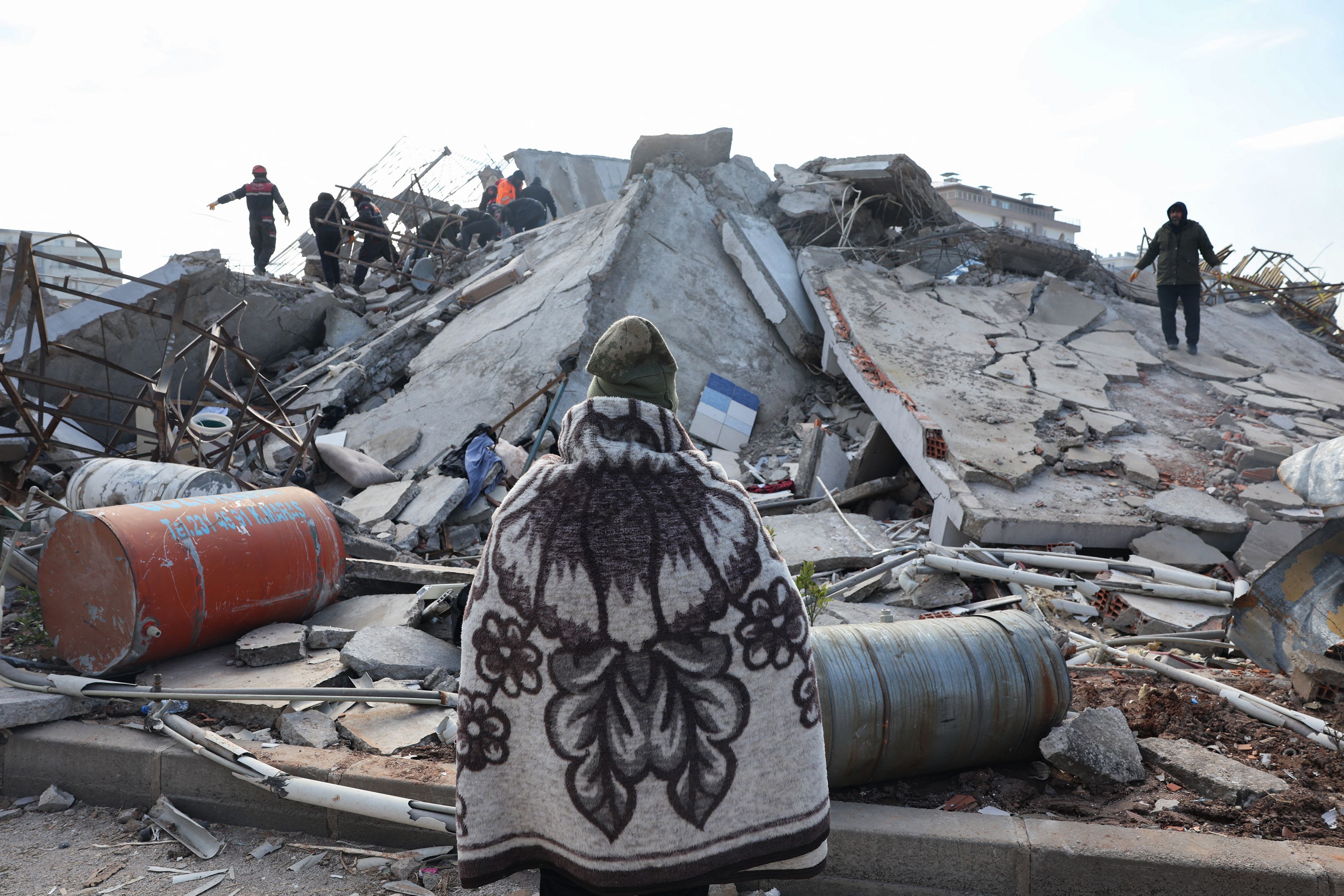 A man looks as rescuers and civilians search for survivors under the rubble of collapsed buildings in Kahramanmaras, close to the earthquake's epicentre, on Wednesday (AFP photo by Adem Altan)